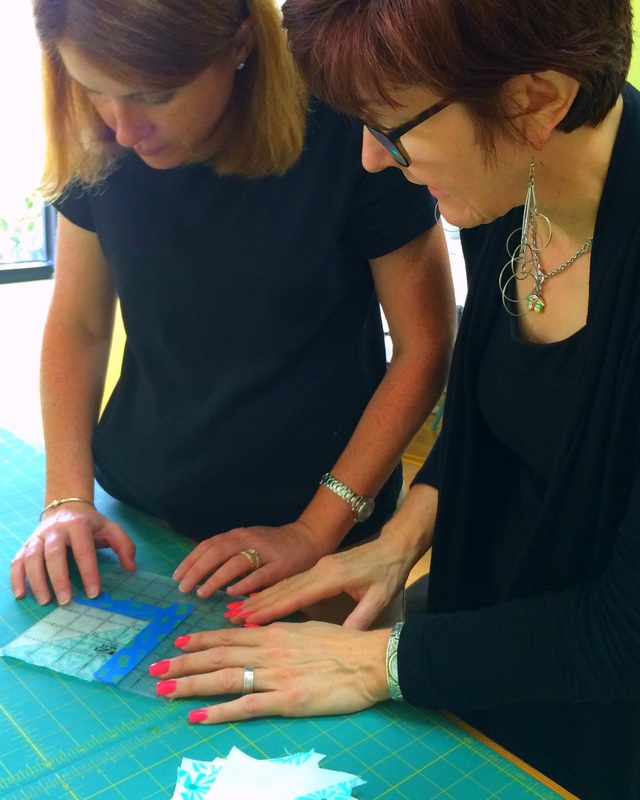 Linda shows Wendy Smyth a measuring technique.